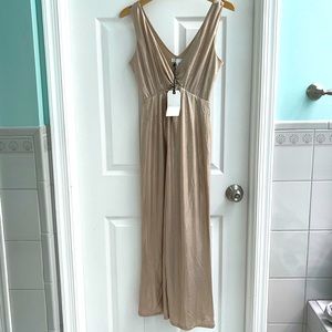 Brand new Metallic gold jumpsuit. Never worn. Tag is still intact